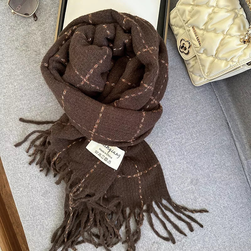 Unisex Fringe Plaid Scarf — brown plaid scarf tied on a gray surface