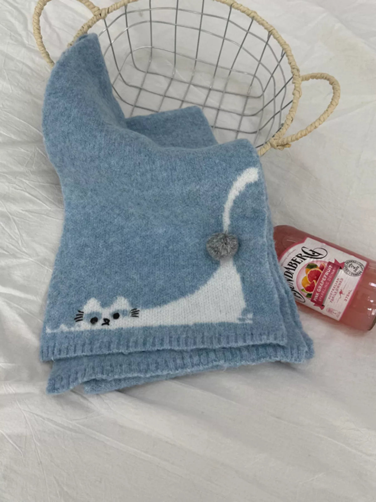 Unisex Playful Cat Knit Scarf — blue knitted scarf displayed with a raised tail detail