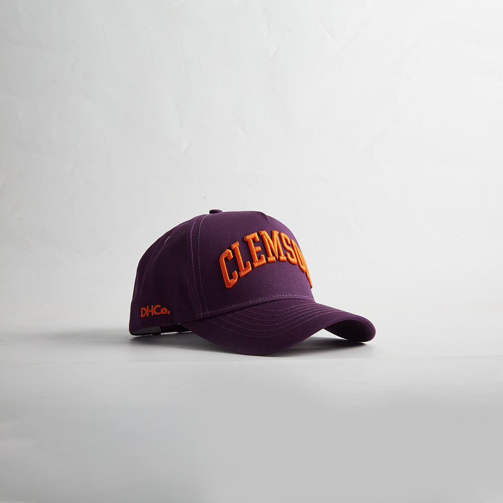 Opposite angled view of the Destination Hat Co. Clemson Legacy snapback showing the orange lettering