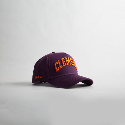 Opposite angled view of the Destination Hat Co. Clemson Legacy snapback showing the orange lettering