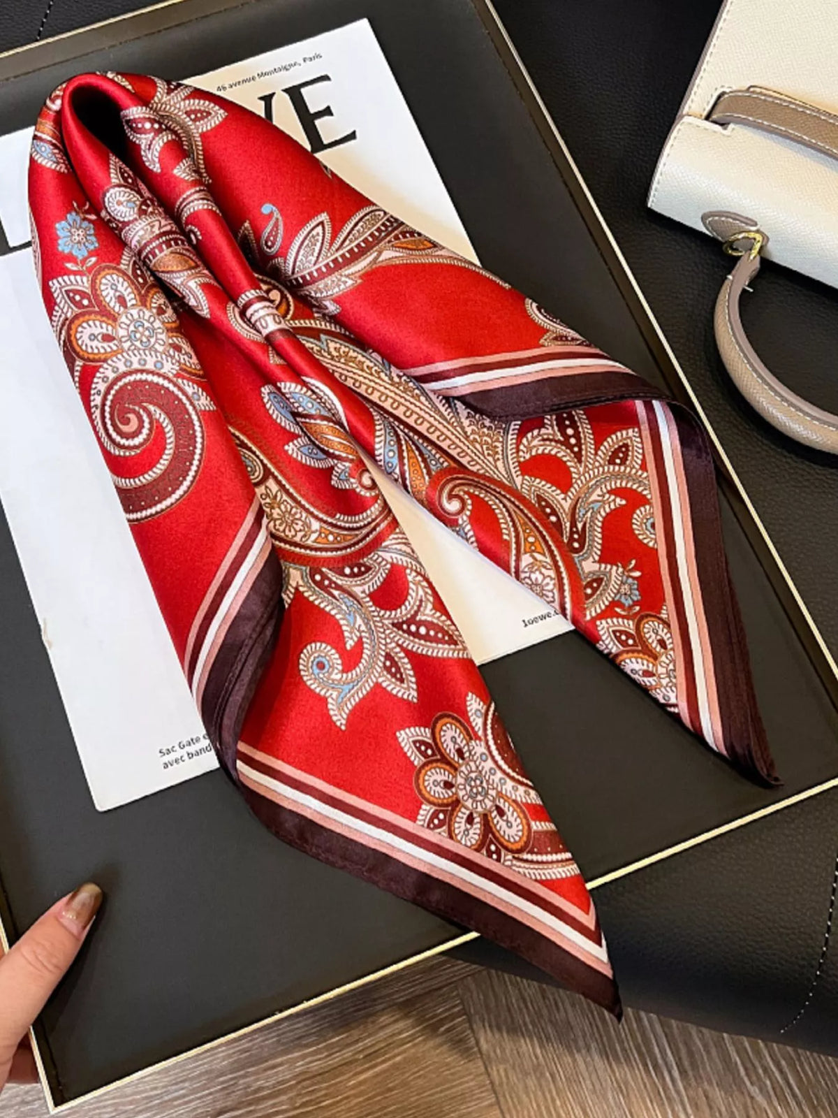 Unisex Vintage Paisley Silk Scarf — folded silk scarf showing ornate scrolls on red
