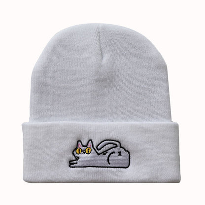 Close front view of white lazy cat embroidered beanie