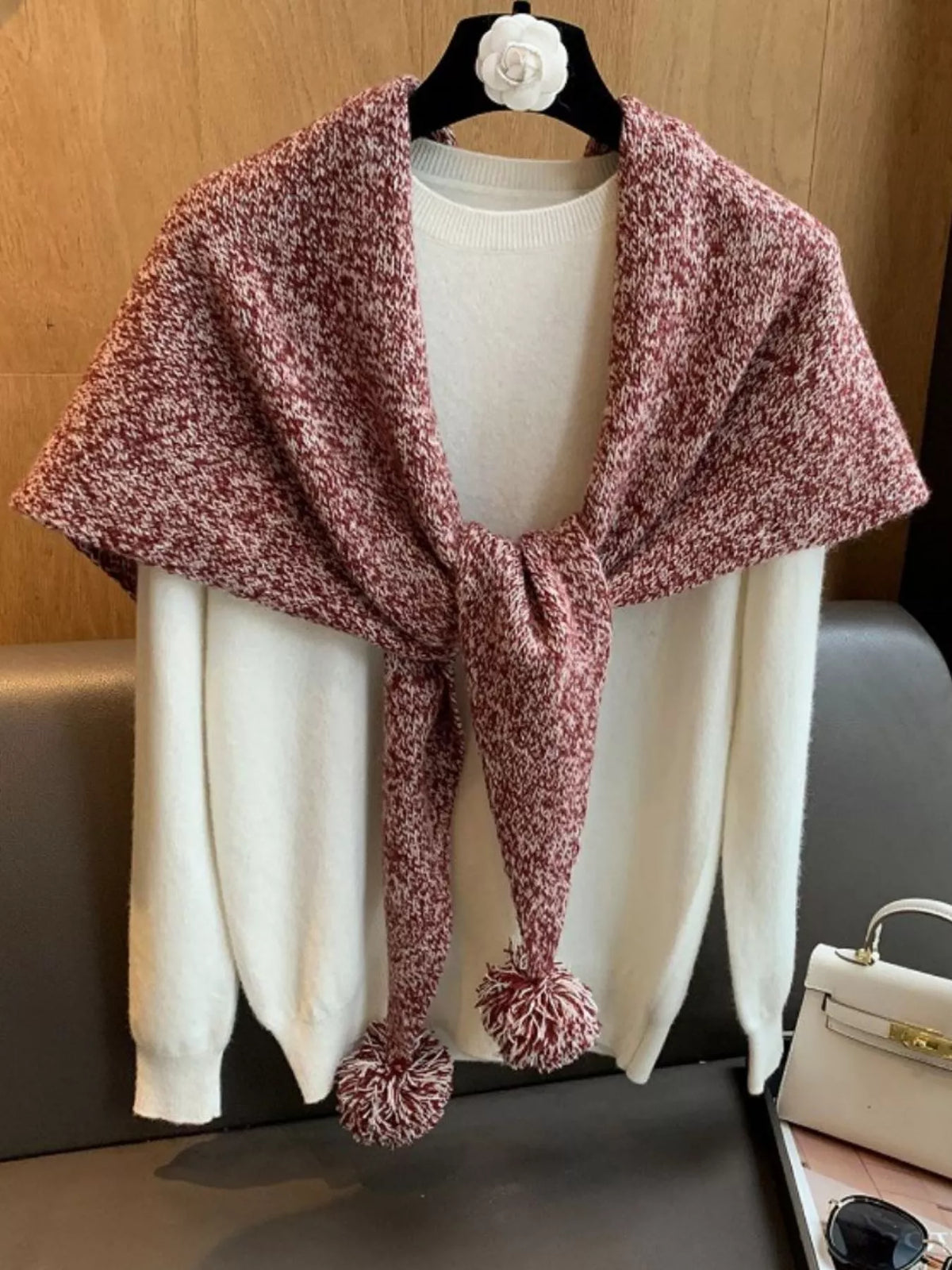 Women's Wool Pom-Pom Shawl — coral wool shawl tied across a pale top