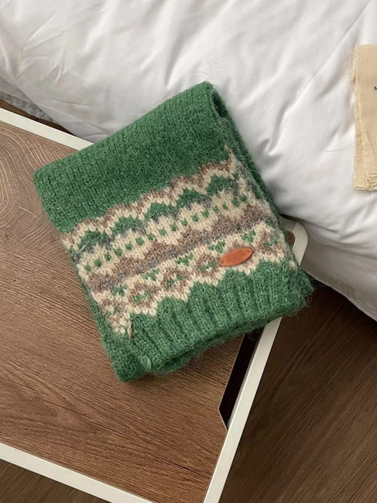 Unisex Nordic Motif Knit Scarf — folded green scarf showing decorative end bands