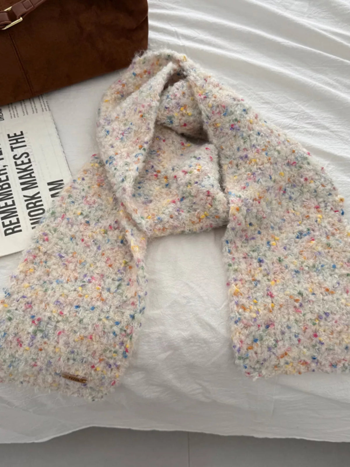 Unisex Multicolor Speckled Knit Scarf — cream scarf arranged with the textured ends spread