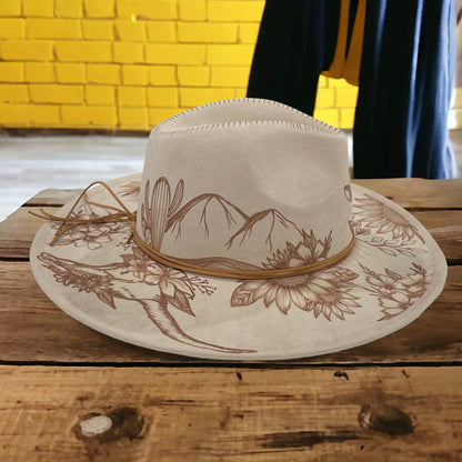Side view of the beige Boho Luxe hat showing burned leaves along the brim