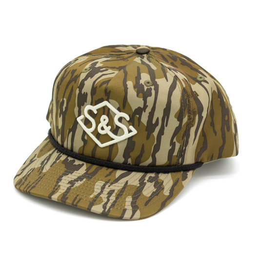 Steel & Saddle Bottomland Badge cap with a cream embroidered badge and black rope