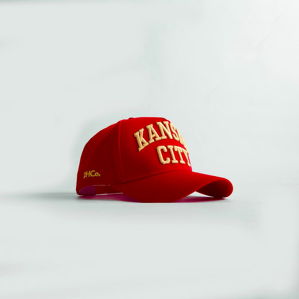 Opposite angled view of the Destination Hat Co. Kansas City Legacy snapback showing the yellow lettering