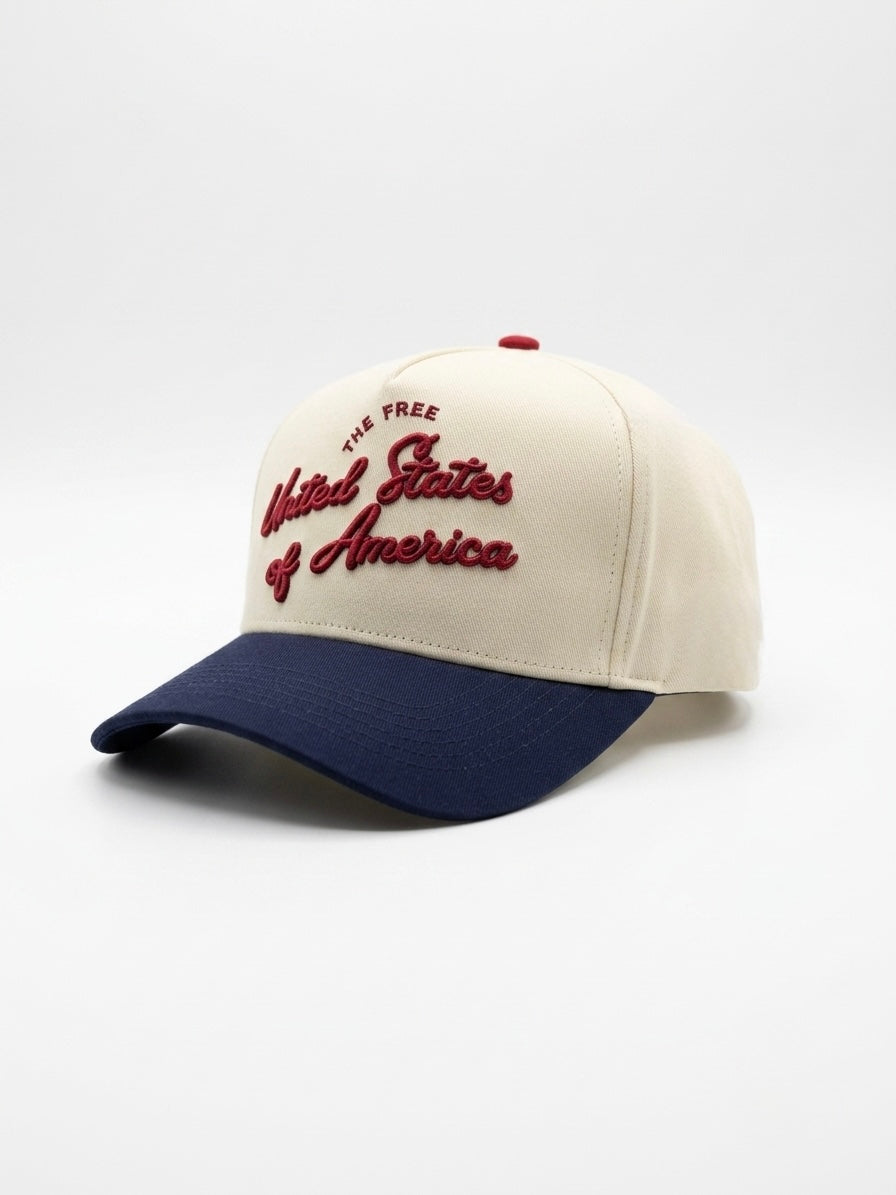 Destination Hat Co. U.S.A. script cap photographed from another angle with the full curved bill visible