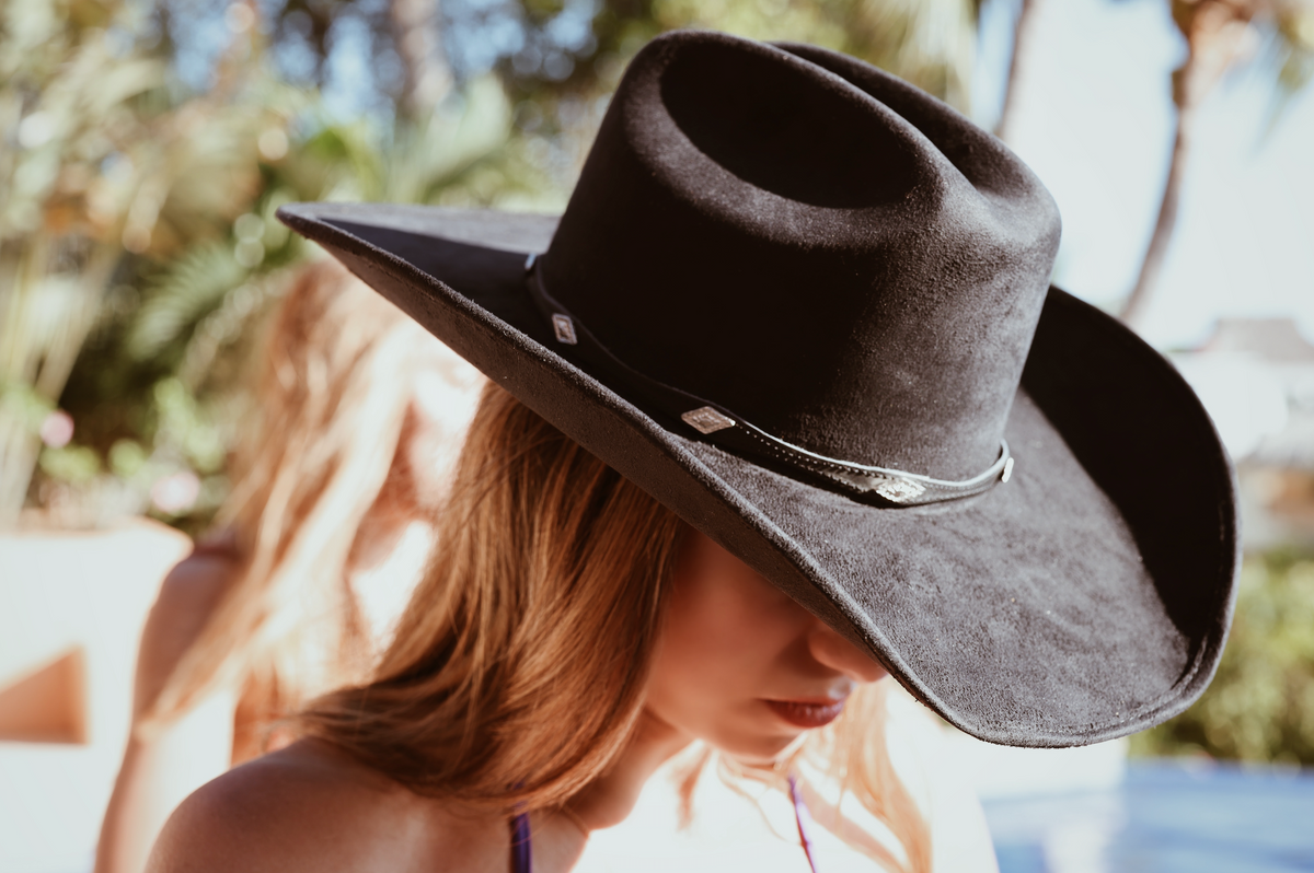 ASN Hats Dolly- Black black cowboy hat, close-up on a model outdoors