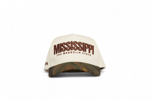 Front view of the Destination Hat Co. Mississippi camo cap with brown embroidery