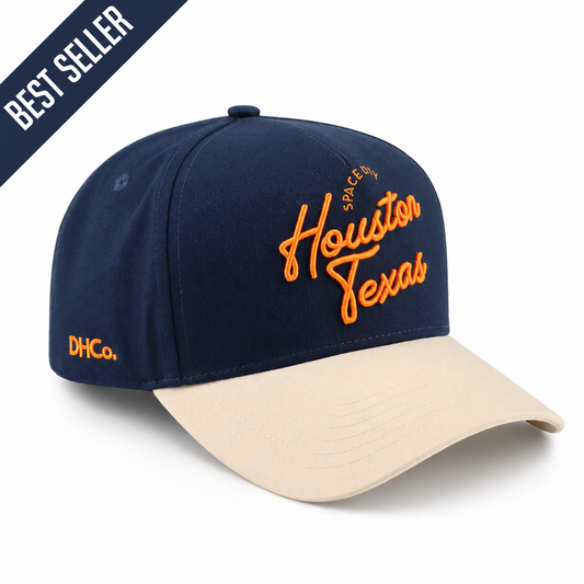 Destination Hat Co. Houston script cap with navy crown and beige bill, angled view