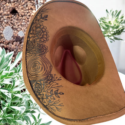 Underside of the Jade cowboy hat with burned botanical details around the inner band