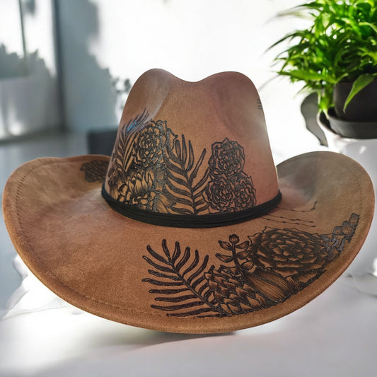 Brown Piper Jade swoop cowboy hat with burned botanical artwork, front view