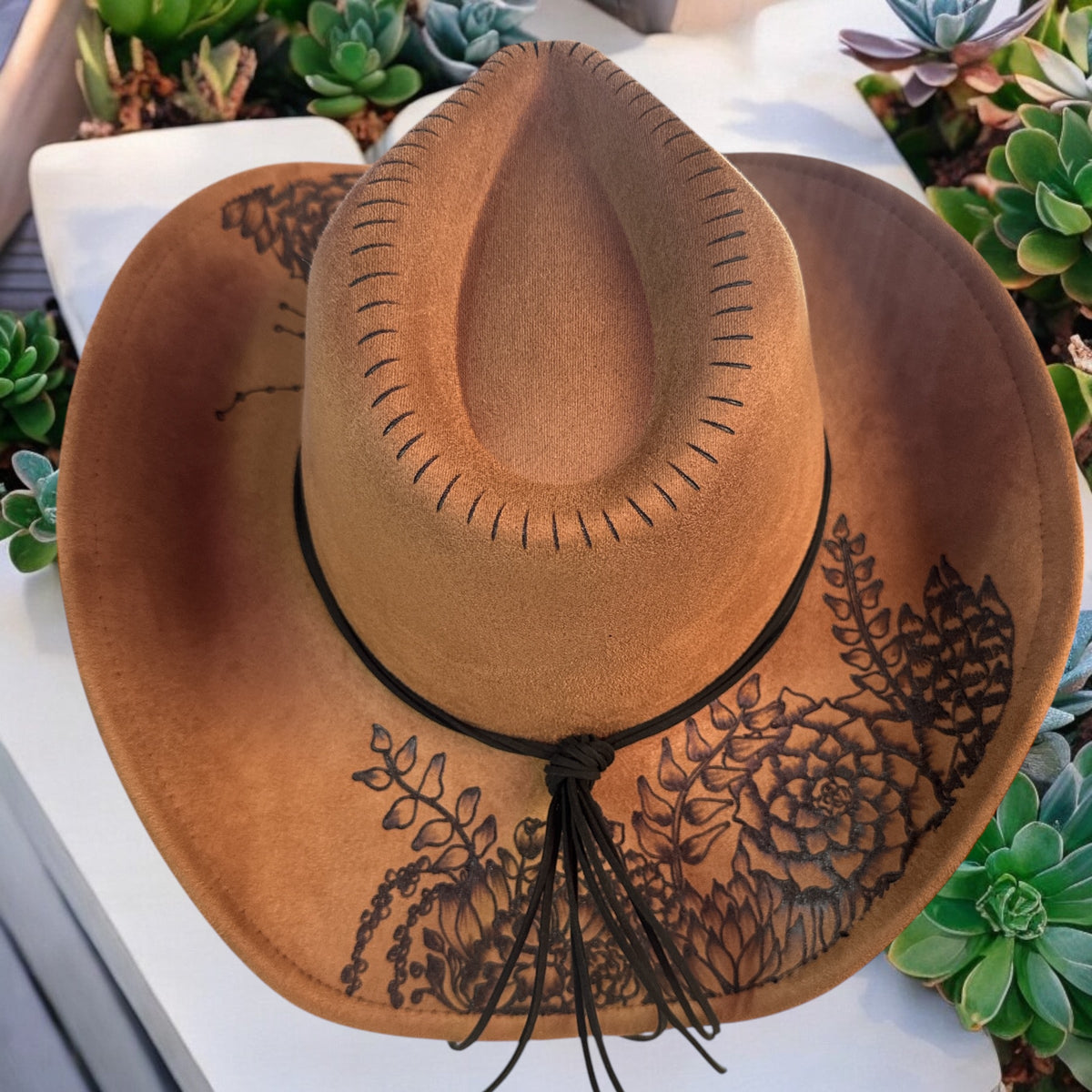 Overhead view of the brown Jade cowboy hat showing the curved brim and crown