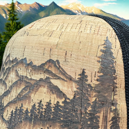 Close-up of the Grand Tetons mountain peaks and evergreen artwork burned into cork