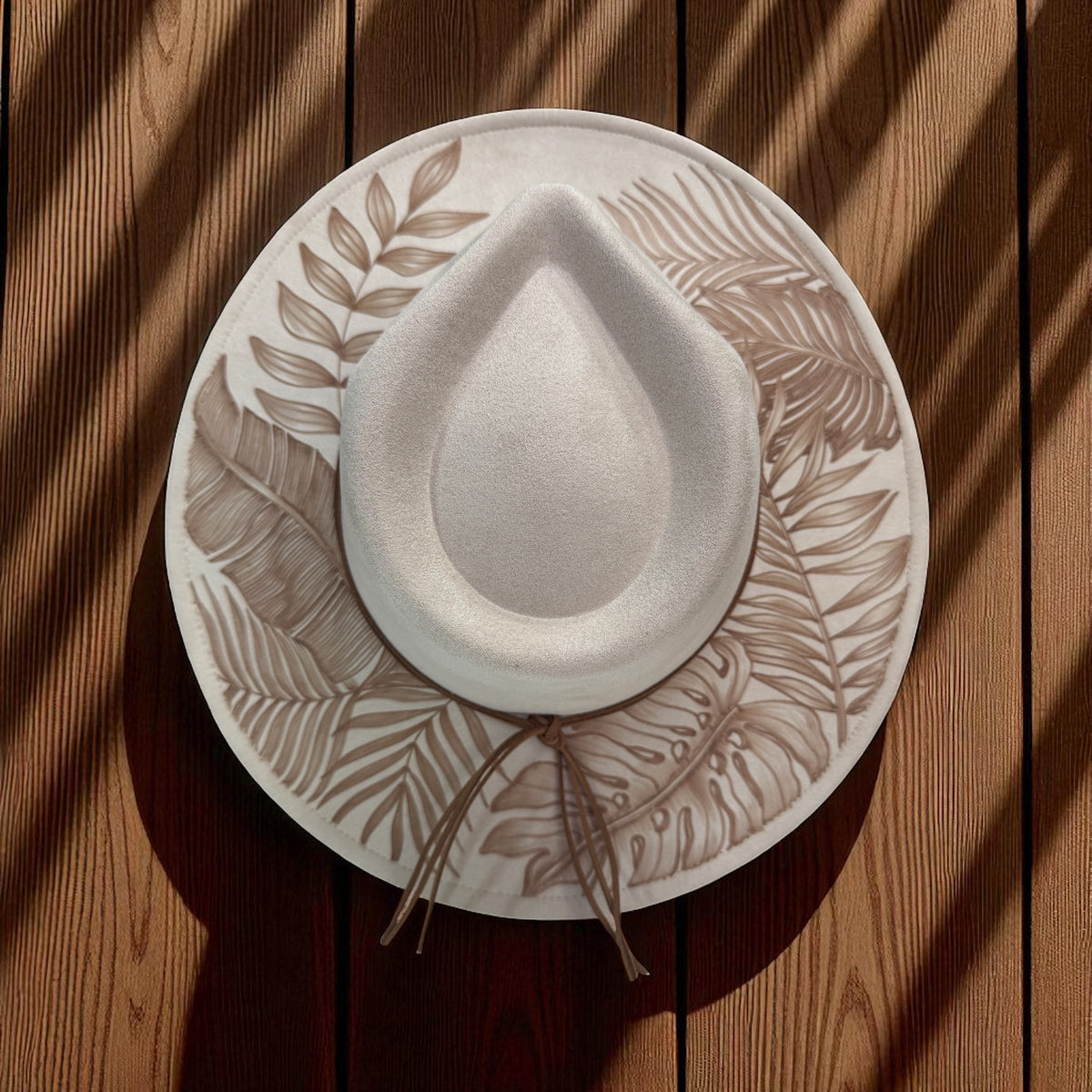 Overhead view of the ivory fedora showing the inner crown line and burned foliage