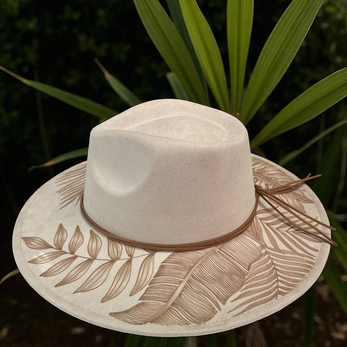 Side view of the ivory High Definition fedora showing its light crown and patterned brim