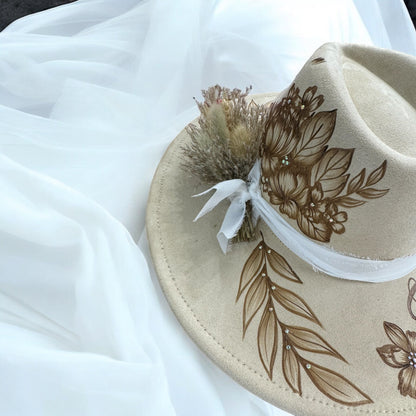 Close-up of dried flowers and chiffon ribbon on the Piper bridal hatband