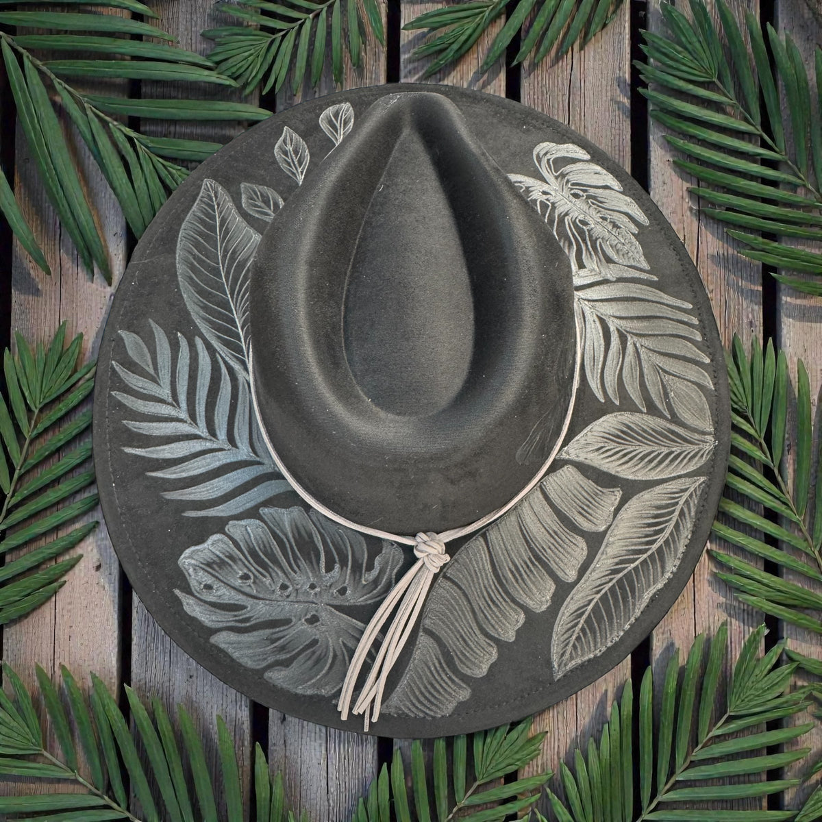 Overhead view of the black High Definition fedora and leafy burn pattern