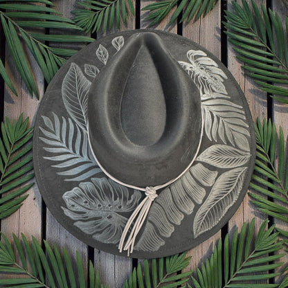 Overhead view of the black High Definition fedora and leafy burn pattern