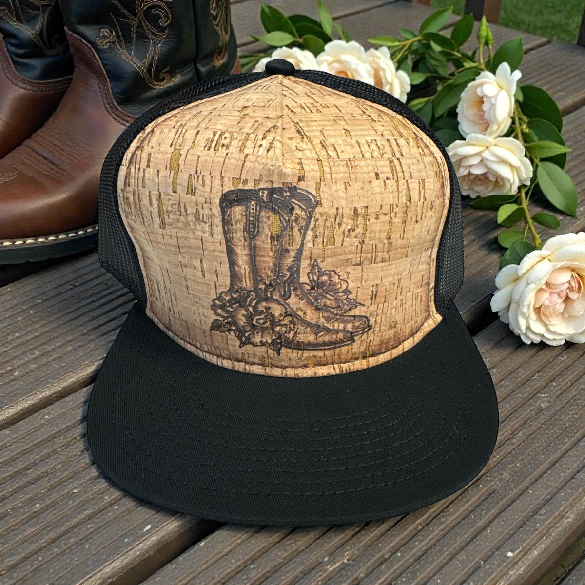 Piper Boots cork trucker hat with burned cowboy boot and floral design, front view