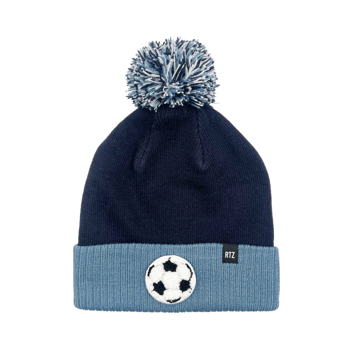 Rey To Z navy and blue pom-pom hat reference photo showing a soccer-ball patch