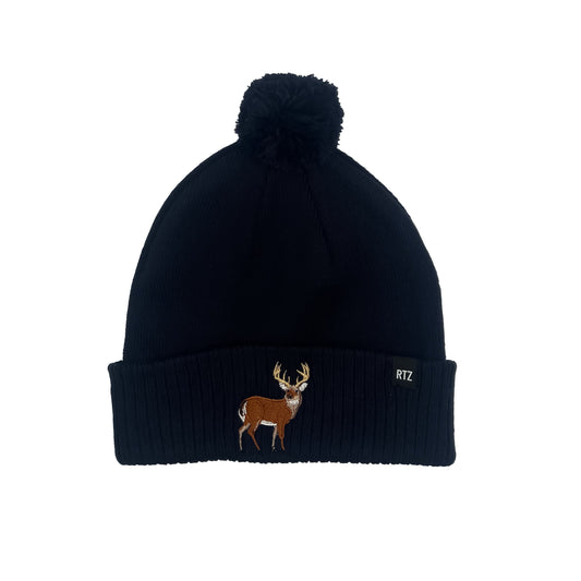 Rey To Z Buck Pom Pom Hat in Navy showing antlered buck artwork on the cuff and a pom-pom top