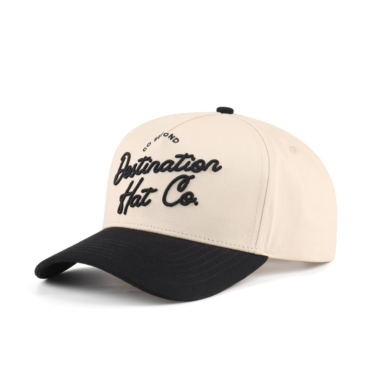 Opposite angled view of the Destination Hat Co. Destination script cap showing the black lettering