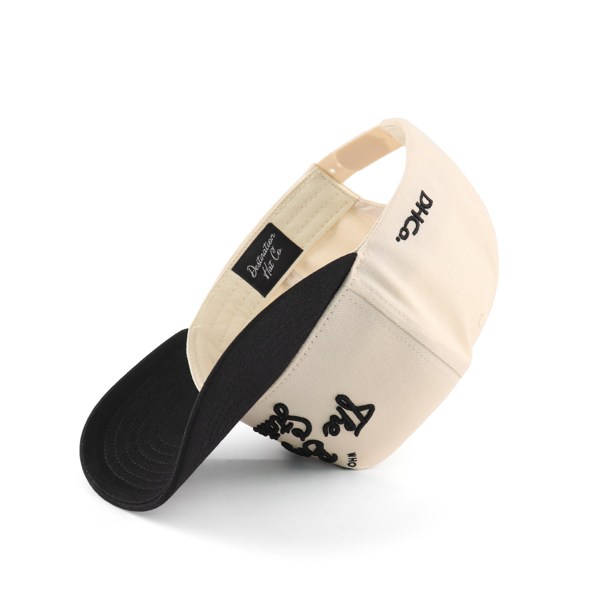 Interior view of the Destination Hat Co. Bayou script cap showing the inner band and underside of the bill