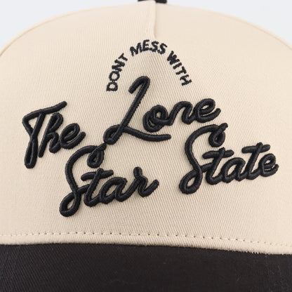 Close-up of the black Lone Star embroidery on the beige crown