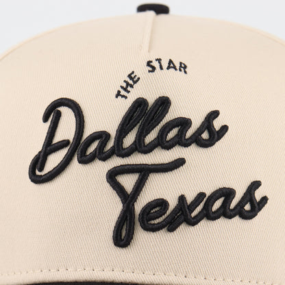 Close-up of the black Dallas embroidery on the beige crown
