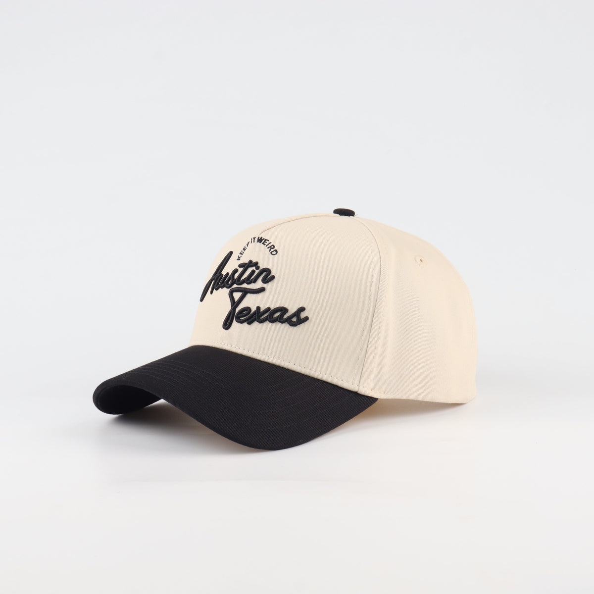 Opposite angled view of the Destination Hat Co. Austin script cap showing the black lettering