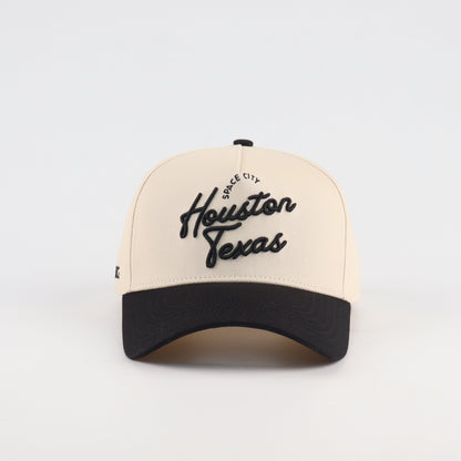 Front view of the Destination Hat Co. Houston script cap with black embroidery