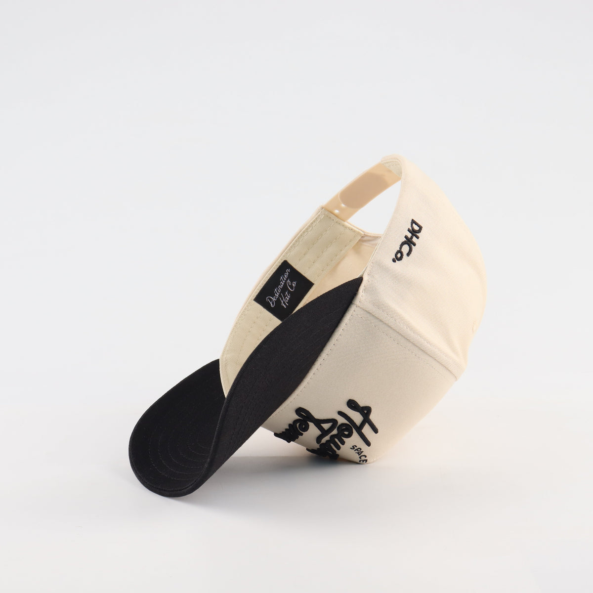 Interior view of the Destination Hat Co. Houston script cap showing the inner band and underside of the bill