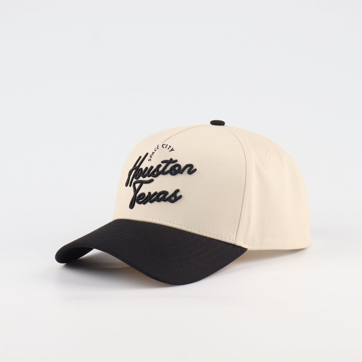 Opposite angled view of the Destination Hat Co. Houston script cap showing the black lettering