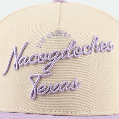 Close-up of the purple Nacogdoches embroidery on the beige crown