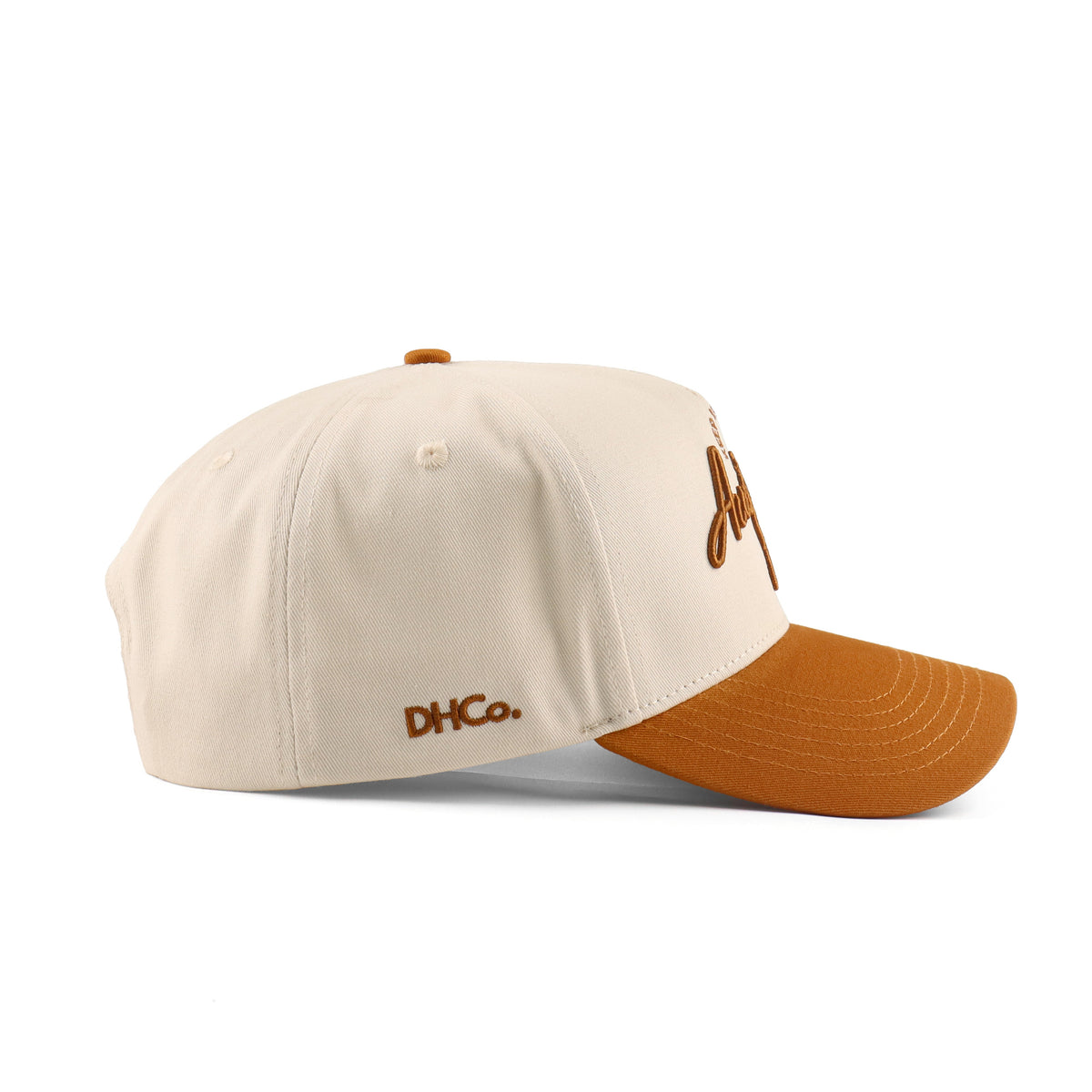Side profile of the Destination Hat Co. Austin script cap showing the curved bill and side logo