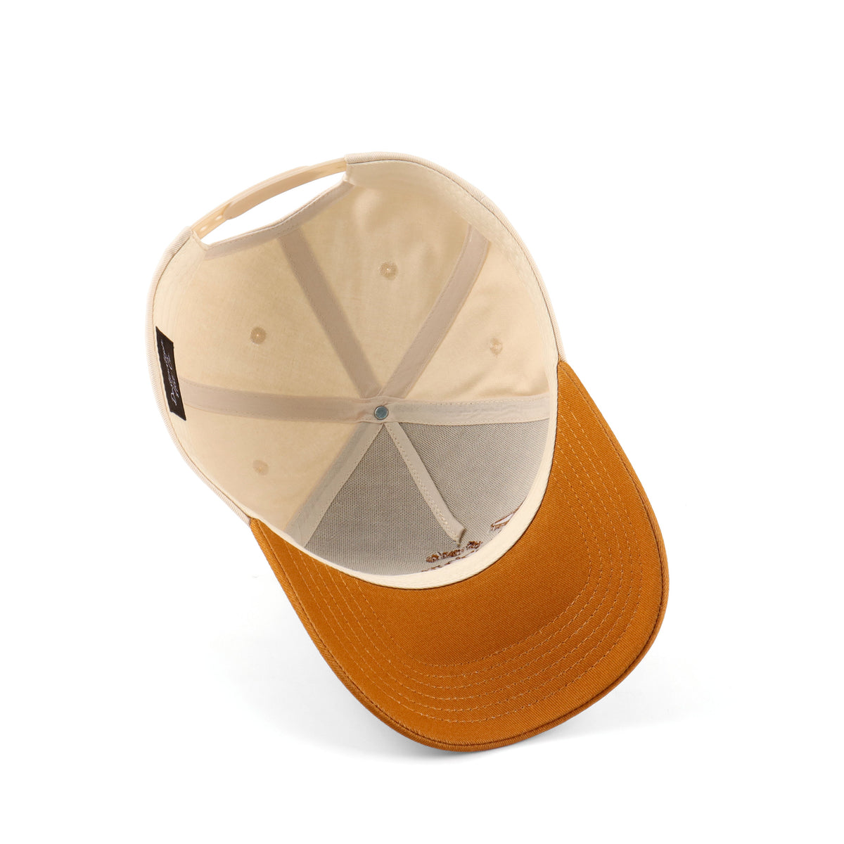 Interior view of the Destination Hat Co. Austin script cap showing the inner band and underside of the bill
