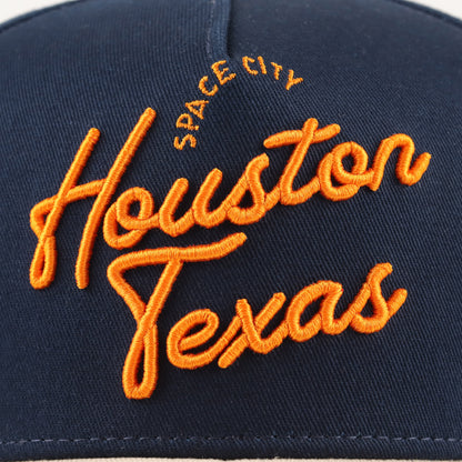 Close-up of the orange Houston embroidery on the navy crown
