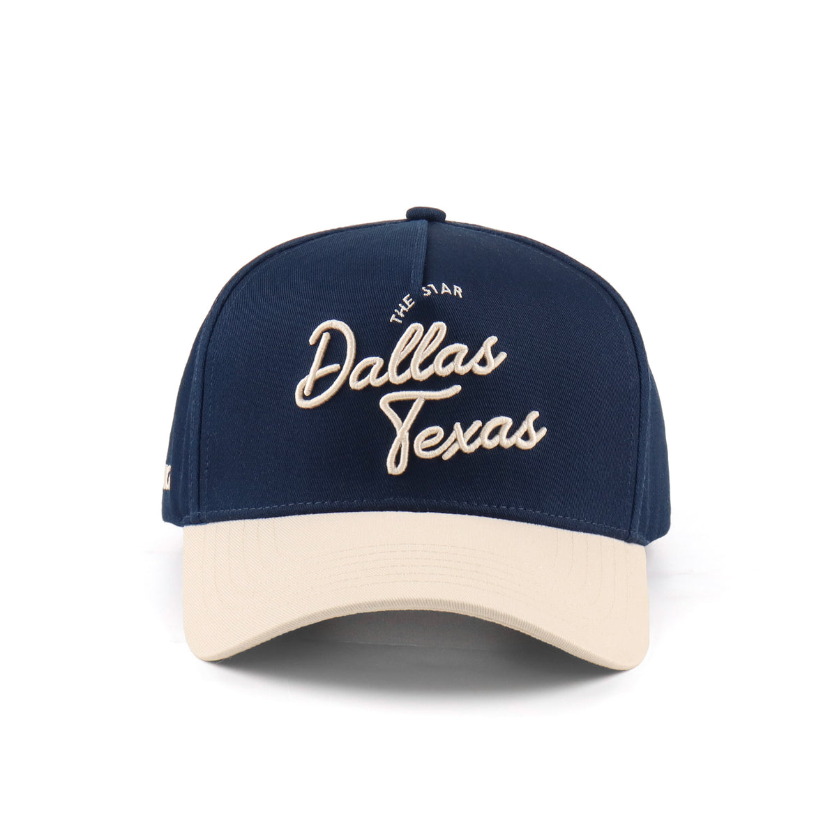 Front view of the Destination Hat Co. Dallas script cap with beige embroidery