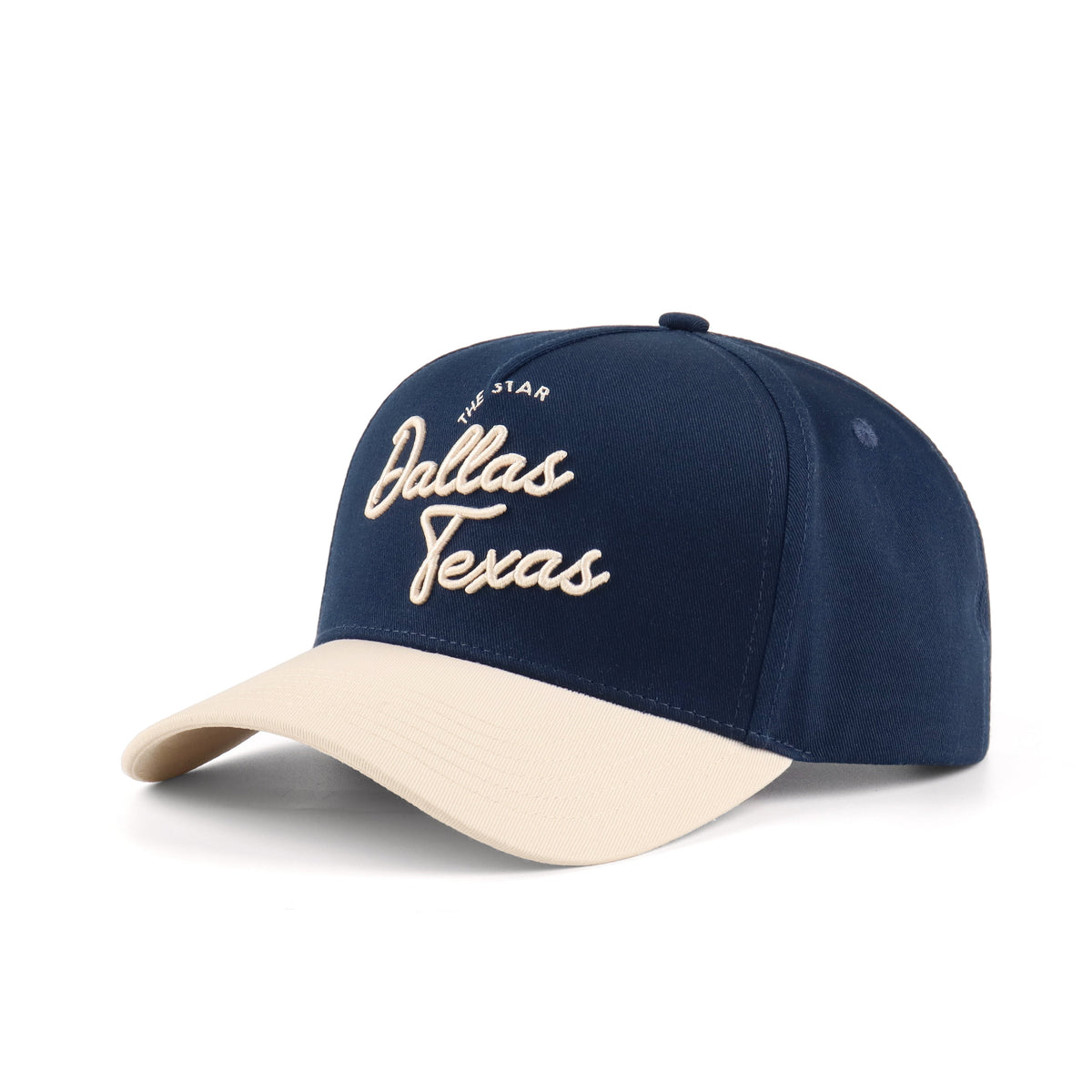 Opposite angled view of the Destination Hat Co. Dallas script cap showing the beige lettering