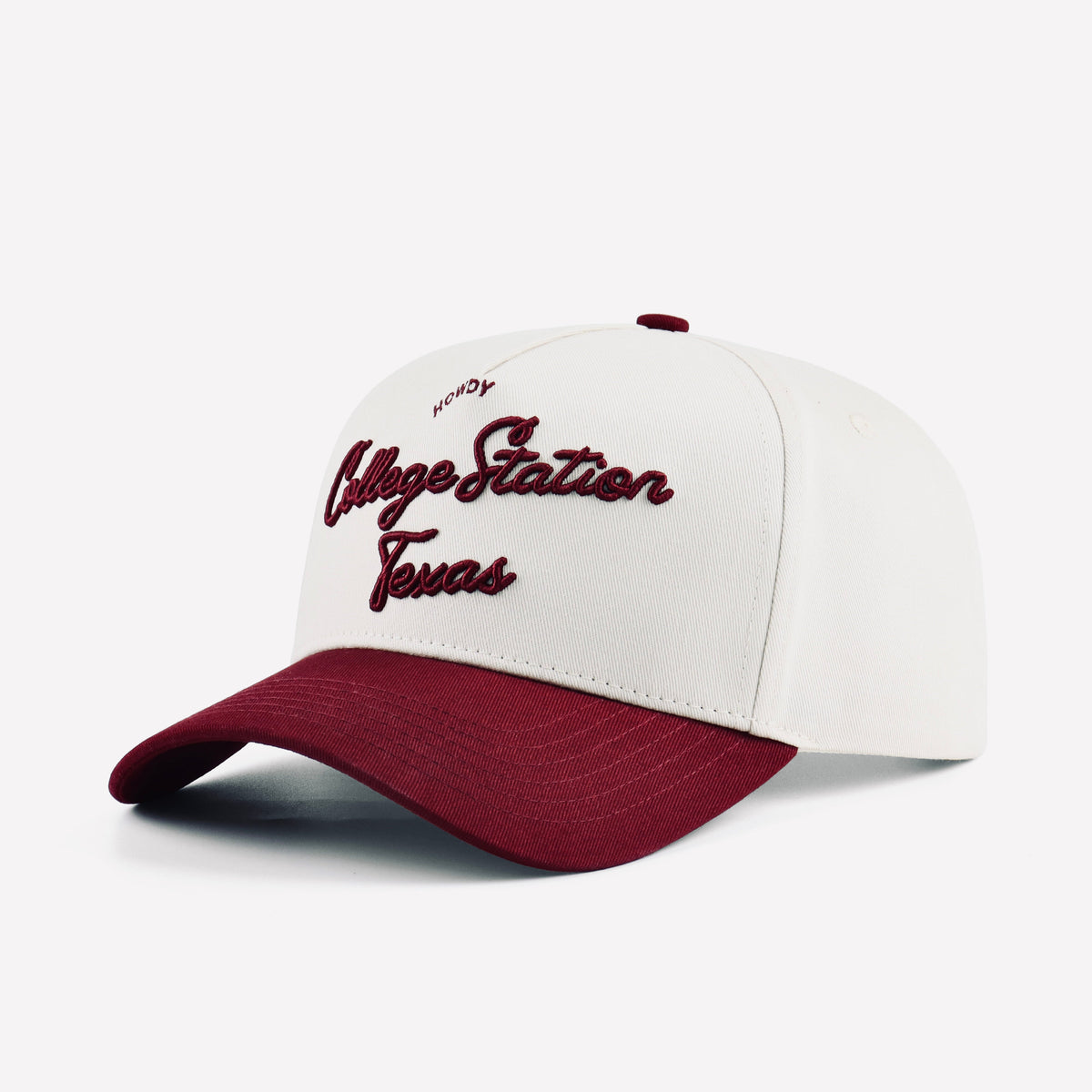Opposite angled view of the beige College Station cap with maroon script