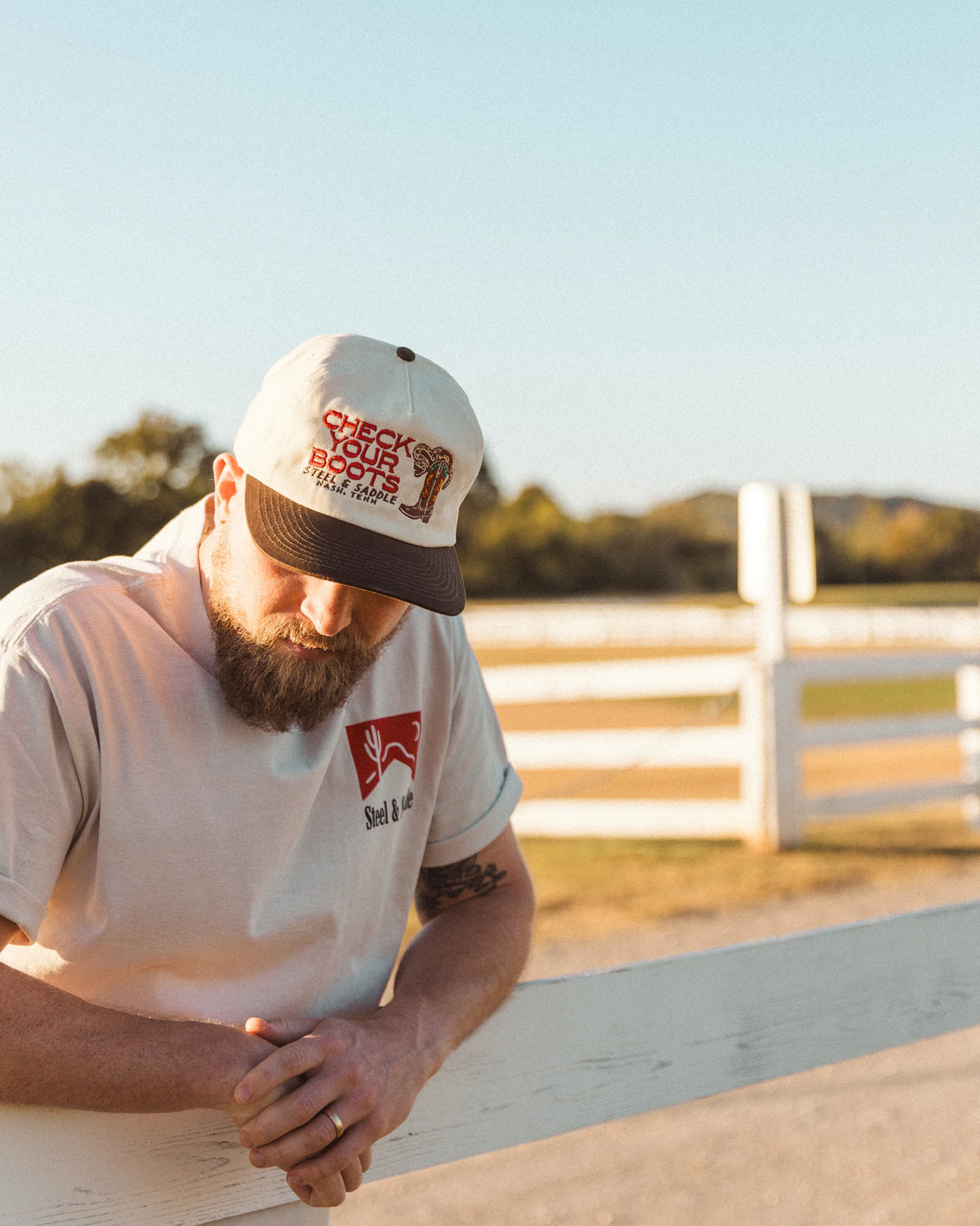 Alternate outdoor view of a model wearing the Rattler cap