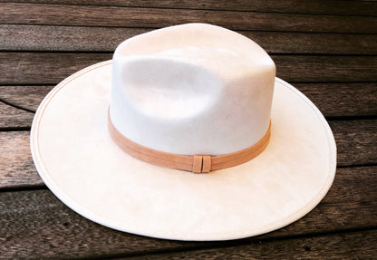 ASN Hats Blanco cream fedora resting on a wooden deck