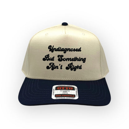 Natural and navy Something Ain't Right embroidered cap