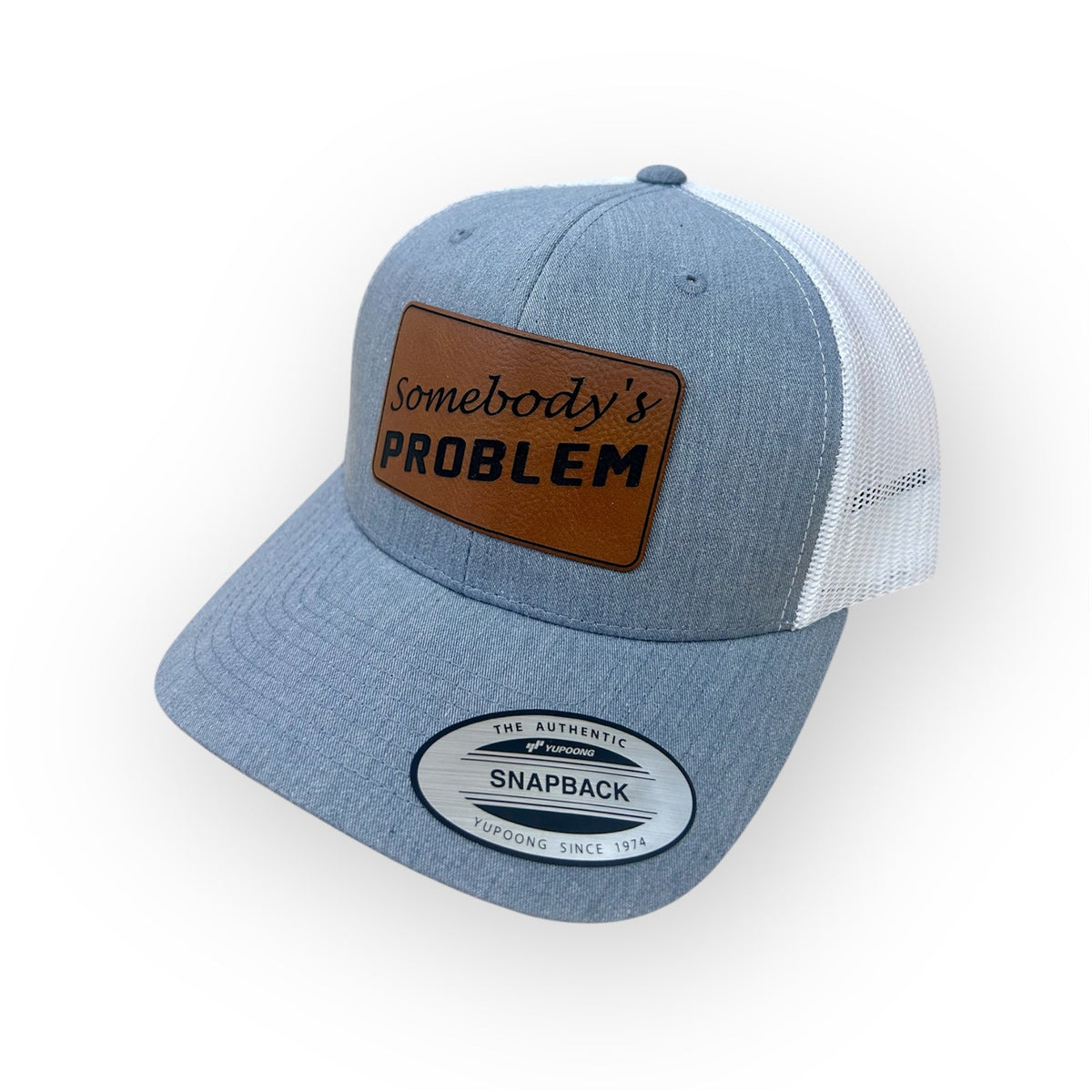 Angled view of the Somebody's PROBLEM patch hat in the Horizon Hat Co. two-hat bundle