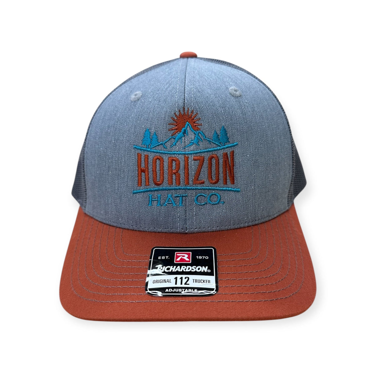 Heather gray and dark orange Horizon logo cap with embroidered mountain design