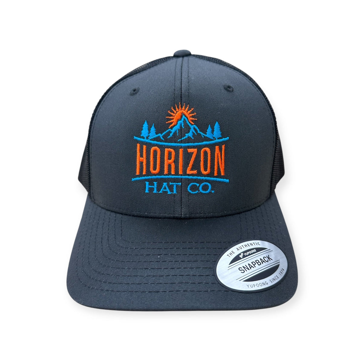 Charcoal and black Horizon embroidered trucker with orange and blue stitching