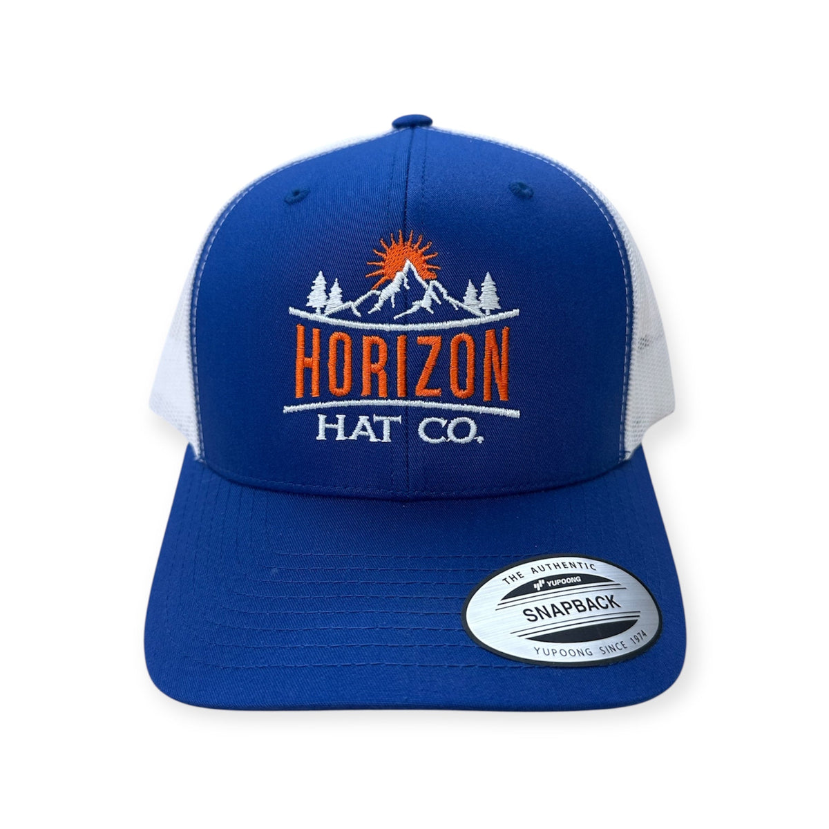 Blue and white Horizon logo trucker with embroidered mountain artwork